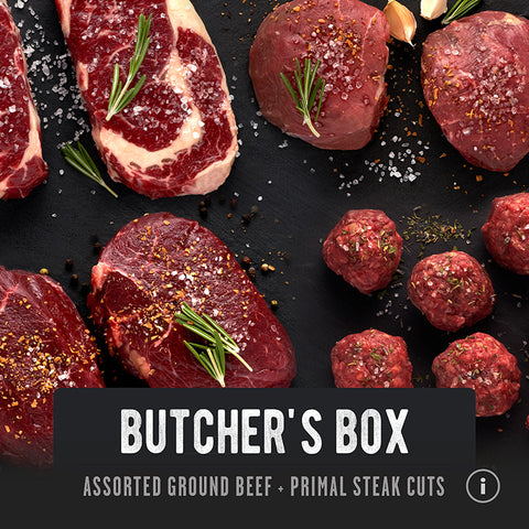 Assorted grass-fed steak cuts including ground beef and various steaks, seasoned and presented on a slate background. Regenerative Beef from REP Provisions