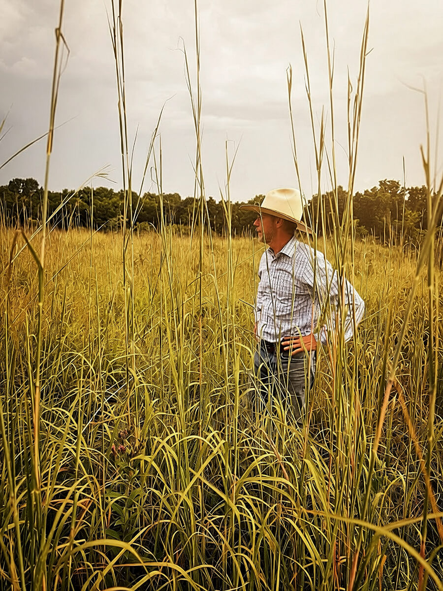 Eric Perner in tall bluestem grass