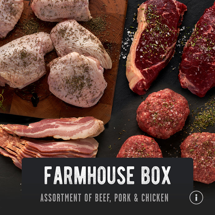 The Farmhouse Box: grass-fed beef, pasture-raised pork and chicken arranged on a cutting board with spices