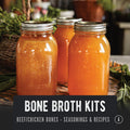 Jars of homemade bone broth in a kitchen setting. Buy grass-fed beef bones and pasture-raised chicken bones with seasonings and recipes to make broth at home. REP Provisions regenerative bones.
