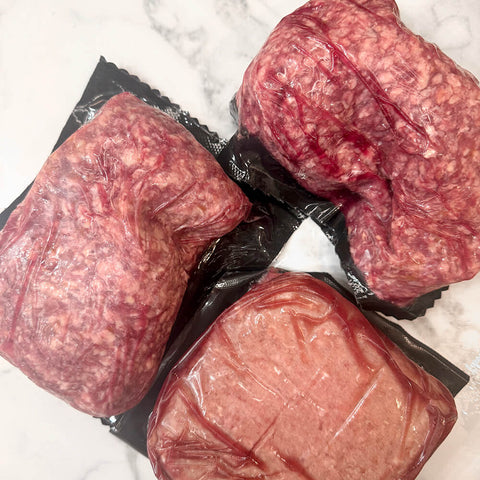 Raw grass-fed ground beef for dogs in vacuum-sealed packages