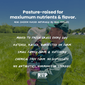 Farmer holding a child in a field with text about pasture-raised chickens and REP Provisions branding.