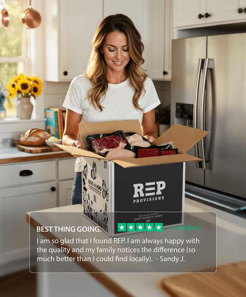 Woman opening a box of REP Provisions, grass-fed beef and pasture-raised meats in a kitchen